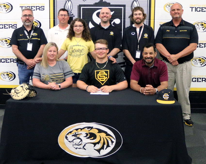 Smith-Cotton High School senior Elias Washington has agreed to join the baseball team at Three Rivers Community College in Poplar Bluff. Seated with him are his parents, Elizabeth and Tim Washington; back, from left, are S-C Principal Wade Norton, S-C Baseball Assistant Coach Justin Wiskur, sister Alivia Washington, S-C Baseball Head Coach Kyle Zimmerman, S-C Baseball Assistant Coach Alex Lang and S-C Athletic Director Rob Davis.