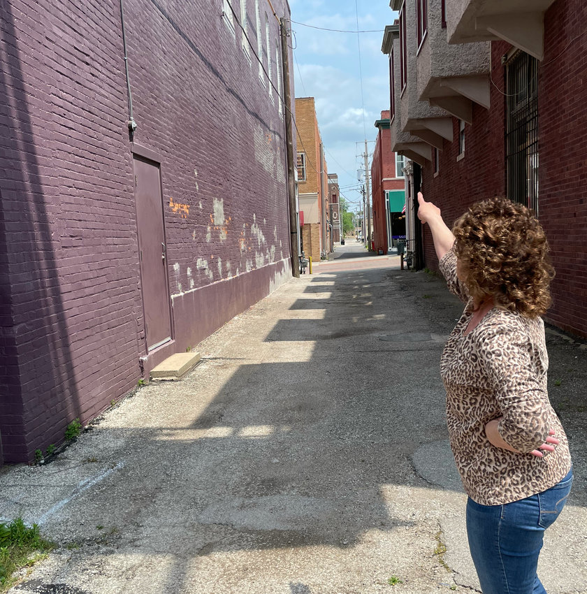 Rebecca La Strada, owner of Becca&rsquo;s Framing and Antiques, points to the new brick tuckpointing work on her building Tuesday. Funds from the Sedalia Central Business and Cultural District helped with some of the funding for La Strada&rsquo;s new facade restoration project.