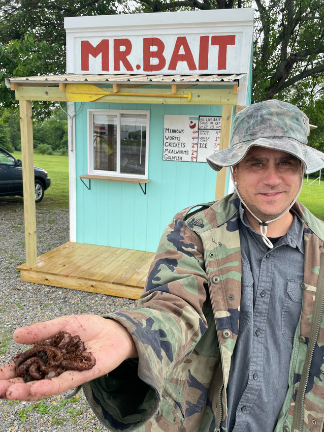 Jared Sirna, seen Thursday, offers minnows, mealworms, crickets and a special Canadian/European nightcrawler sure to please the pickiest trout.