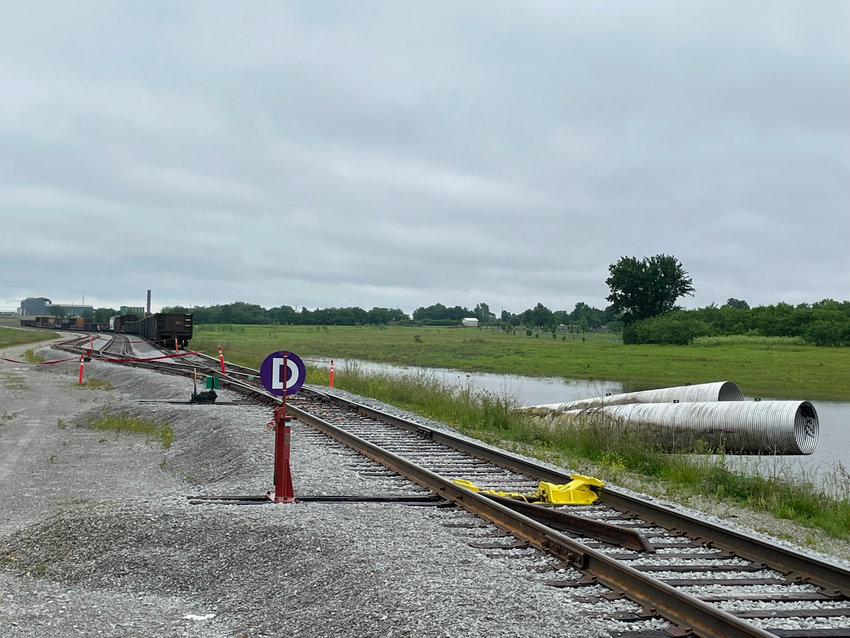 Drainage culverts under the rail spur are bent up at an angle as the heavy flooding pushed a wall of water against the levee, causing the culverts to fail.