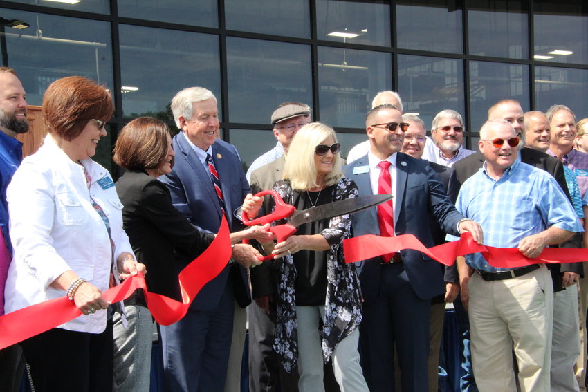 Olen Howard&rsquo;s daughters Darlene Bradbury and Shirley Rowden alongside Gov. Mike Parson, State Fair Community College President Joanna Anderson and Mayor Andrew Dawson cut the ribbon for the new Olen Howard Workforce Innovation Center on Thursday morning.