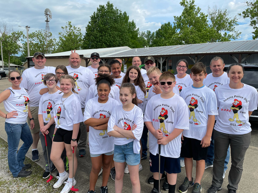 Sedalia Police officers and D.A.R.E. students gather at Leisure Park Friday for the inaugural D.A.R.E. Camp, a way for officers and students to bond and have fun while resisting drugs.