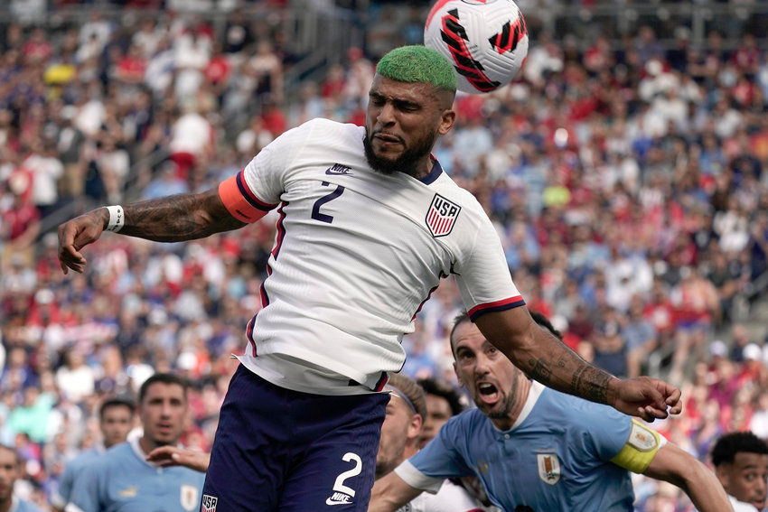 USA defender DeAndre Yedlin (2) blocks a shot attempt during the first half of an international friendly soccer match against Uruguay Sunday, June 5, 2022, in Kansas City, Kan.