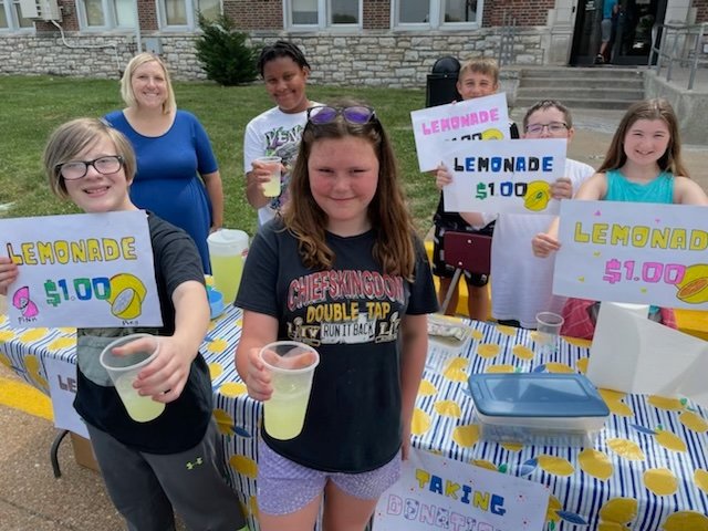 From left in front stands Daniel Weathers and Vivian Crane. From left in the back stands math teacher Ashley Kruse, Johnathon Pierce, Dmitriy Turschin, Chase Slaughter and Olivia Pyle. The class came together for the 10:30 a.m. lemonade stand session to raise money for Alex&rsquo;s Lemonade Stand Foundation.