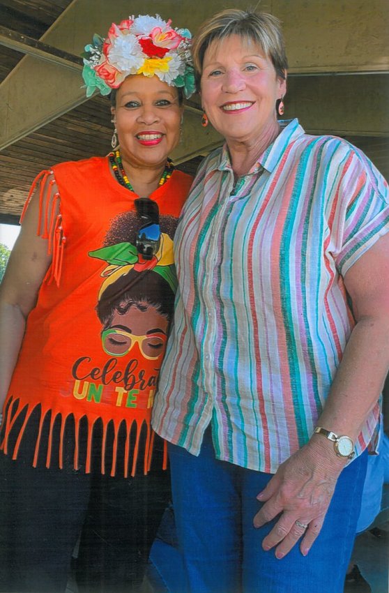 NAACP Sedalia Chapter President Alona Boggess-Reid, left, stands with Kathy Baker, right, one of her old classmates from Smith-Cotton High School, during the Juneteenth Celebration on Saturday, June 18 at Hubbard Park.