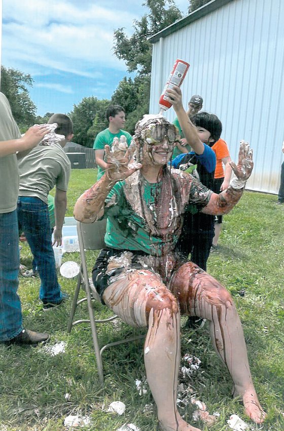 Beth Lusk is turned into a human sundae during the Applewood Church VBS program. The boys won a competition this month with the girls to raise money for Sedalia&rsquo;s Birthright Crisis Pregnancy Center and were given the opportunity to douse Lusk with ice cream, whipped cream, chocolate, and strawberry syrup and sprinkles. As a result, the students raised $1,647.89, and an anonymous church donor gave another $1,500.