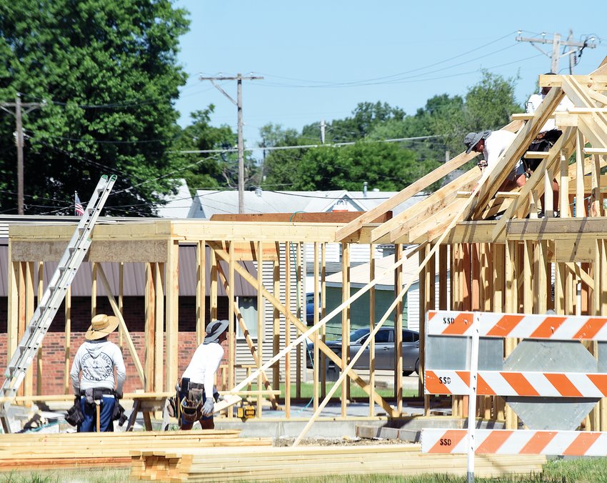 Workers with Expert Construction wear wide-brimmed hats on Tuesday to block the sun as they work in the summer heat at 17th street and Ingram Avenue. The National Weather Service noted the Sedalia area was under an excessive heat advisory until Thursday, with heat index values expected Tuesday afternoon to be 108.