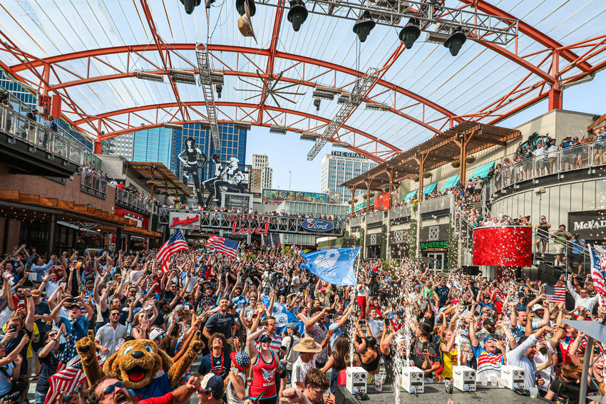 Fans celebrate Thursday afternoon at KC Live! in the Power and Light District as Kansas City was selected as a host city for the 2026 FIFA World Cup.