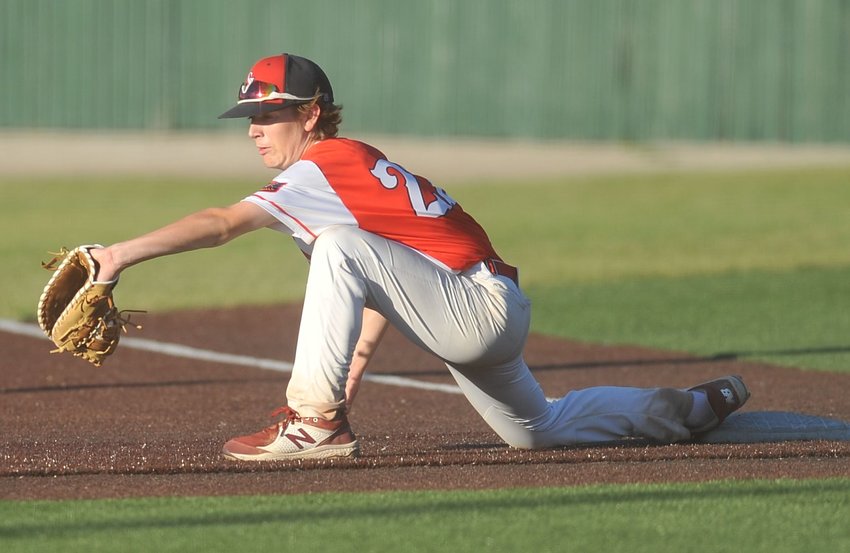 First baseman Keaton Fry stretches to glove a ball on a throw that beats the runner in one of Sedalia Post 642 AUX&rsquo;s wins June 30 over Mid-Missouri Elite.
