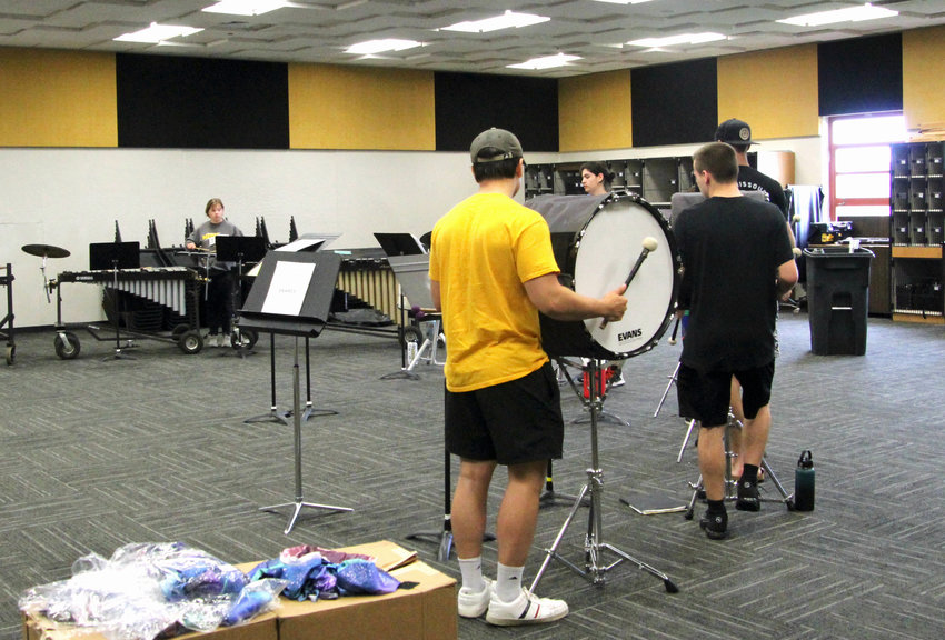 On Wednesday morning, the Smith-Cotton High School Marching Tigers drumline works with new percussion coordinator Jason Joy during band camp. Band camp is split into two weeks to give the drumline and color guard more practice.