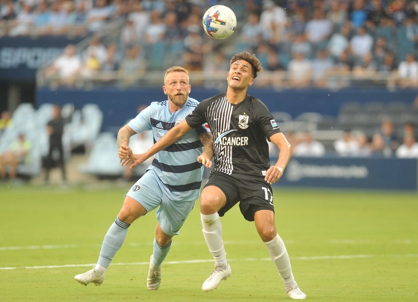 Sporting Kansas City forward Johnny Russell (left) battles for positioning in a U.S. Open Cup match against Union Omaha at Children&rsquo;s Mercy Park on June 22, 2022.