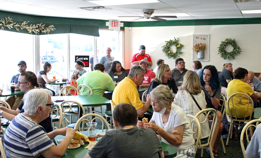 Customers pack Mighty Melt Sandwich and Spud Shop during its reopening on Tuesday, Aug. 2. The Sedalia shop originally closed in January after 37 years of operation. According to Might Melt&rsquo;s new owner Jeffrey Whitford, the community response was so great that at 2:30 p.m., the shop was still working hard to complete back orders.