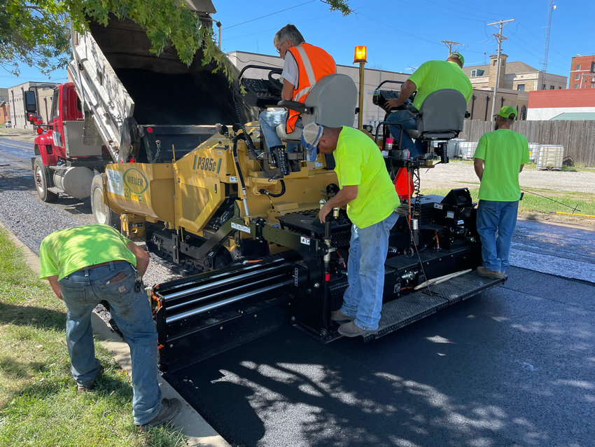 The City of Sedalia&rsquo;s new Ziegler P385c commercial paver takes its inaugural run down city streets Tuesday. South Massachusetts Avenue from Third to Fifth Street was quickly paved by crew supervisor Roger Vieth, orange vest, and public works employees.