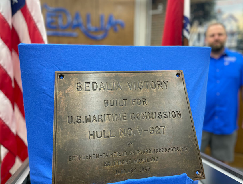 The ship builder&rsquo;s plate from the USS Sedalia Victory was donated to the City of Sedalia for display at City Hall. War bond sales helped the Victory-class ship be named after Sedalia.