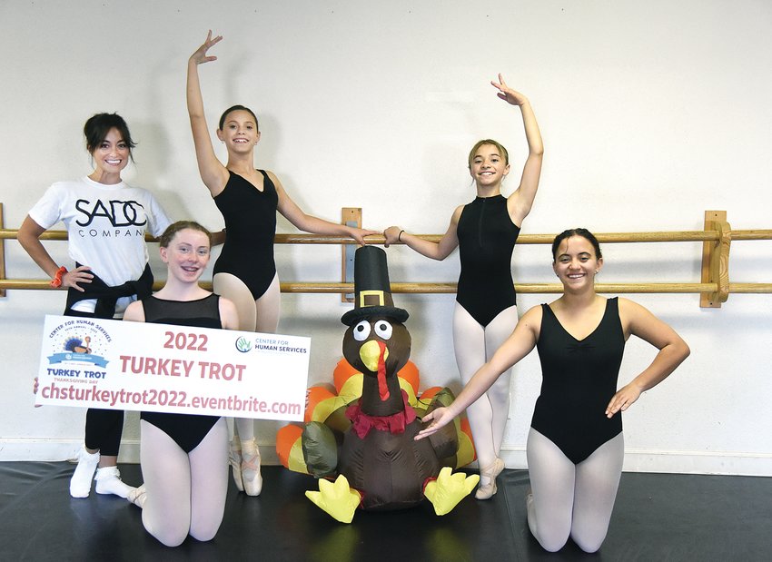 Studio A Dance Conservancy students, from left, Adelyn Ray, 12, Harley Andrews, 12, Ella Cason, 10, and Ayden Cason, 12, stand with studio owner and director Anna Crumley Nelson on Wednesday. Studio A students are volunteering time at the Center for Human Service's 14th annual Turkey Trot fundraiser slated for Thanksgiving morning.
