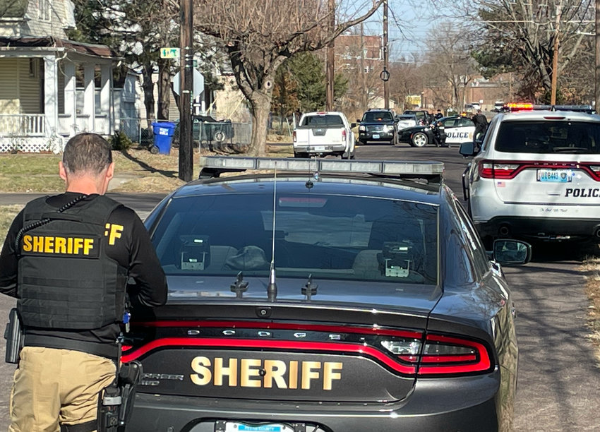 Members of the Sedalia Police Department and the Pettis County Sheriff&rsquo;s Office surround a house in the 1200 block of South Washington Avenue Monday morning. An active shooter situation was called in by a third party to the Pettis County Joint Communications Center.