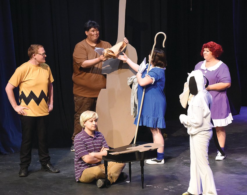 Liberty Center Association for the Arts will present &ldquo;A Charlie Brown Christmas&rdquo; on Friday, Saturday, and Sunday at the Hayden Liberty Center. Lucy, played by Olivia Smith, talks with Pigpen, portrayed by Matt Dillion, in a scene during dress rehearsal Tuesday night.