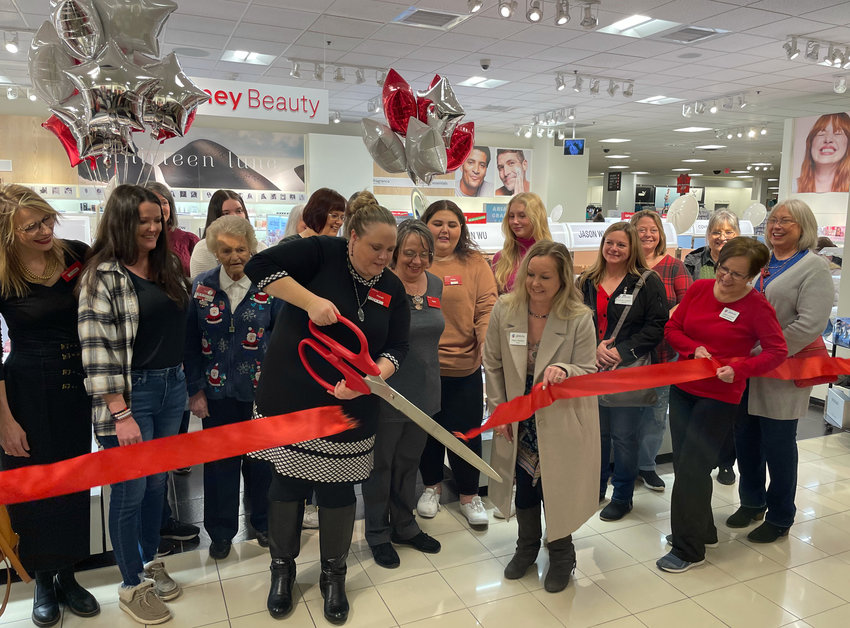 JCPenney General Manager Marah Ireland cuts the ribbon to JCPenney Beauty, Friday with the help of Sedalia Area Chamber of Commerce President Katie Shannon