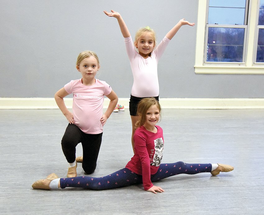 Ruby Cox, left, Mia Jones, and Hadley Newton, doing the splits, strike a pose during rehearsal for their upcoming Saturday recital at the Smith-Cotton Junior High. The girls are students with Dance with Grace through the Sedalia Parks &amp; Recreation Department. Grace Belnap directs the Dance with Grace program.