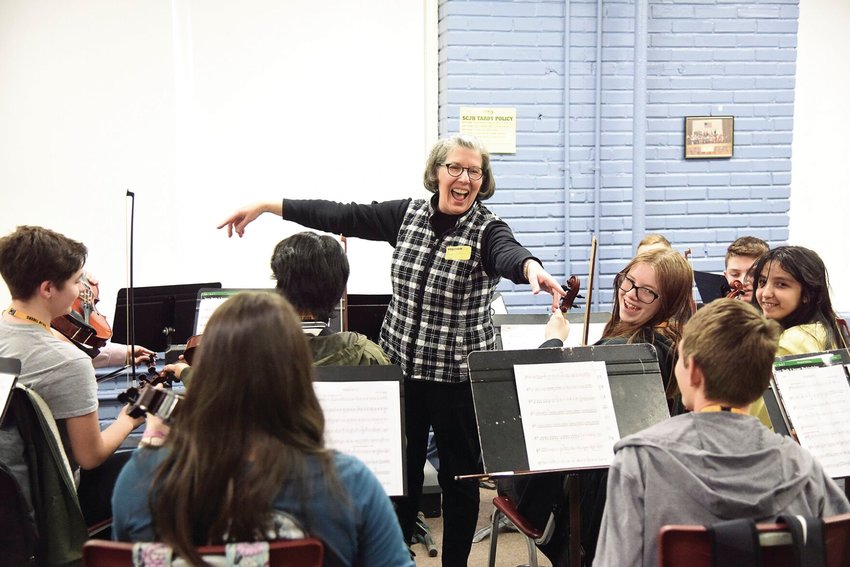 Thursday morning, guest instructor Barbara Mathis Miller, of Kansas City, smiles as she asks eighth grade Smith-Cotton Junior High orchestra students to play their &ldquo;A&rdquo; string. SCJH students practiced with Miller on Thursday and Friday and will present a Stringfest Concert at the school at 3:30 p.m. Friday. The Sedalia Symphony Society sponsors the concert.
