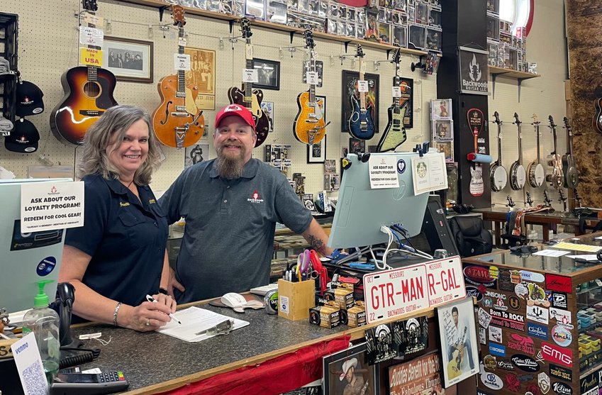 Janette Harms and Eron Harding of Backwoods Guitar, 120 S. Osage Ave., are celebrating the store's 10th year selling and servicing guitars in Sedalia.   Photo by Chris Howell | Democrat