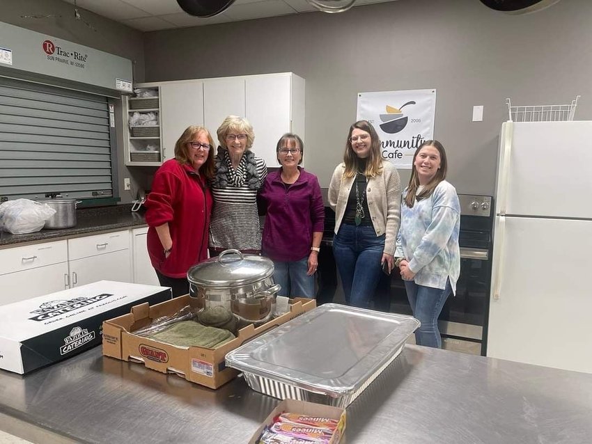 Teresa Fowler and friends serve a meal at the Community Cafe. Also pictured is Corie Hickman and on the far right is Student Board President Bailey Brown.