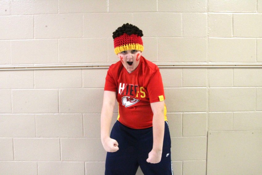 Third grader Jase Patrick shows his best game day cheer during Skyline Elementary&lsquo;s Red Friday. He is decked out in a Kansas City Chiefs shirt, Patrick Mahomes hair beanie and face paint.&nbsp;