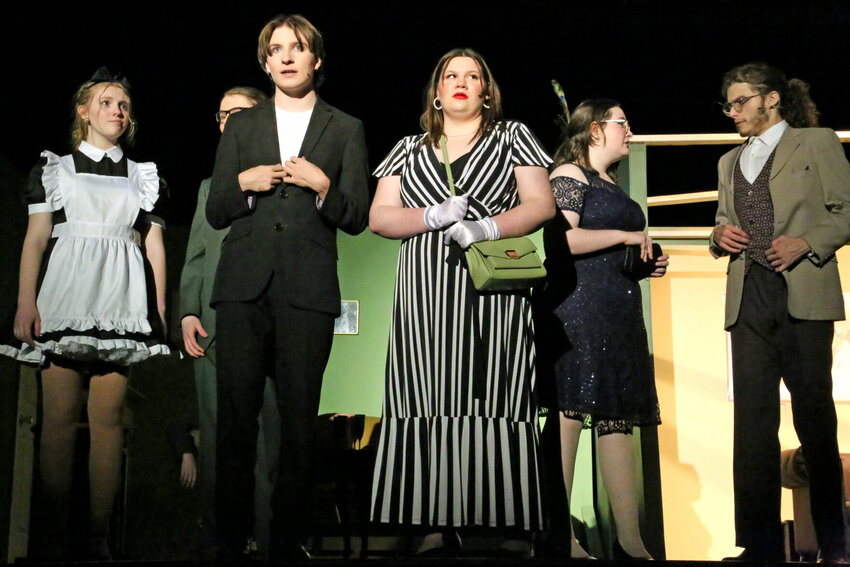 From left, Yvette (Emily Eschbacher), Mr. Green (Carter Ray), Wadsworth (Brady Rowland), Ms. White (Kenley Anderson), Mrs. Peacock (Alana Ayers) and Professor Plum (MacAllister Gartner) start to pair off as the group tries to track down the killer during rehearsal Wednesday, April 12 for the Smith-Cotton High School production of &quot;Clue: High School Edition.&quot;   Photo by Nicole Cooke | Democrat   &nbsp;