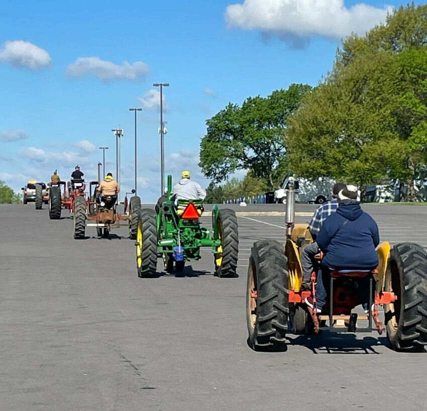Tractors head west from State Fair Community College for the second annual SFCC Ag Club Tractor Cruise on Saturday, April 29. Money raised will support educational trips for agriculture students.   Photo by Chris Howell | Democrat