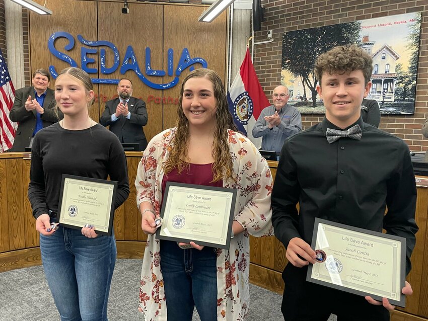Sedalia Parks and Recreation Department lifeguards Natali Newkirk, Emily Lesmeister and Jacob Cordia receive Life Save awards Monday, May 1 at the Sedalia City Council meeting for their March 25 rescue of a drowning victim at the Heckart Community Center pool.   Photo by Chris Howell | Democrat