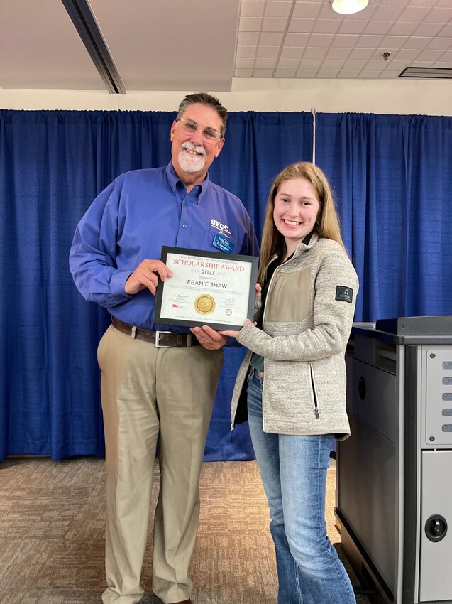 State Fair Community College President Dr. Brent Bates presents Knob Noster High School senior Ebanie Shaw with the 3M Transformational Scholarship April 19 on the Sedalia campus during the National Letter of Intent Signing Day for Career and Technical Education.   Photo courtesy of State Fair Community College.