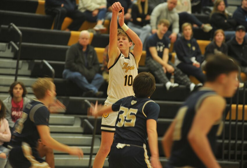 Smith-Cotton&rsquo;s Dax Wiskur attempts a 3-pointer in the fourth quarter of Tuesday night&rsquo;s home defeat to Helias.   PhotoCredit: Photo by Bryan Everson | Democrat