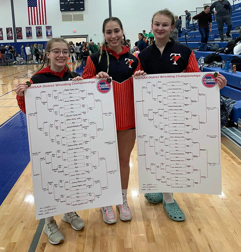 Tipton's trio of state qualifiers &ndash;&ndash; Rachel Loganbill, Holly Parker and Lily Burns &ndash;&ndash; show off their hardware and winning brackets after the Class 1 District 2 Tournament last weekend.   PhotoCredit: Photo courtesy of Tipton R-VI School District