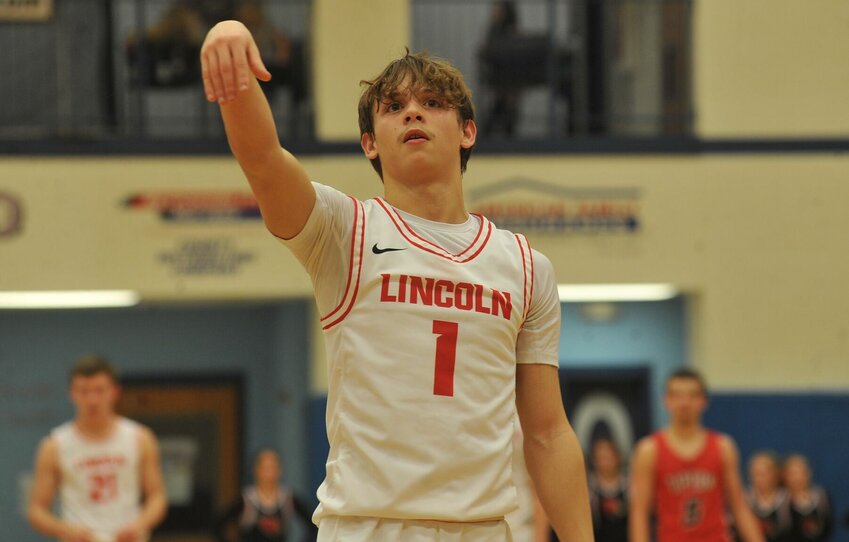 Lincoln senior Kaleb Mundy knocks down a free throw in the fourth quarter of Saturday night's Kaysinger Conference Boys Tournament Championship at State Fair Community College.   PhotoCredit: Photo by Bryan Everson | Democrat