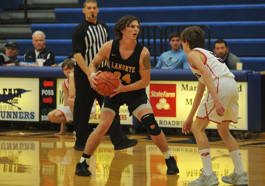 La Monte junior Tyler Weber, a first-team All-Kaysinger selection, handles the ball in a game at State Fair Community College on Dec 17, 2022.   PhotoCredit: File photo by Bryan Everson | Democrat