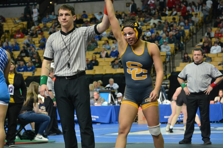 Smith-Cotton's Jasmine Wolfe has her hand raised after defeating Raytown's Amaya Johnson in the Class 2 130-pound fifth-place match at Mizzou Arena.&nbsp;   PhotoCredit: Photo courtesy of Melissa Burks