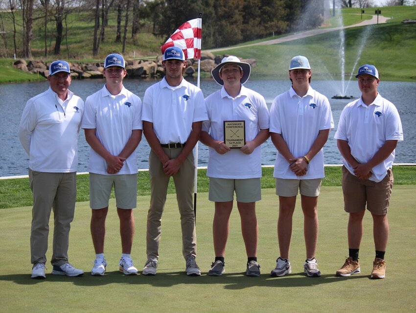 Cole Camp's Gage Oelrichs holds the first-place trophy from Thursday's Kaysinger Boys Golf Tournament at Mules National Golf Club alongside teammates&nbsp;Matthew Bright, Spencer Godwin, Wyatt Hesse, Tyler Howard and head coach Brandon Harding.   PhotoCredit: Photo by Bryan Everson | Democrat