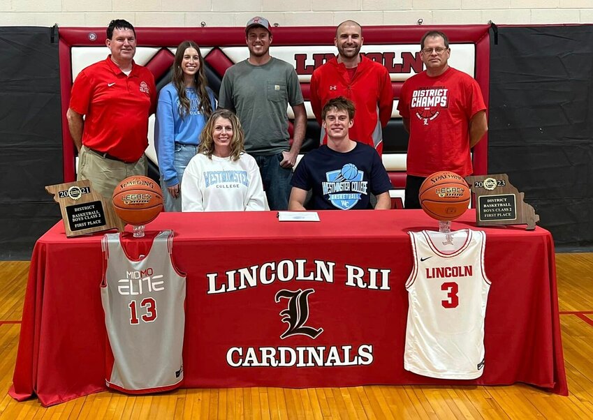 Pictured with family and his coaches, Lincoln senior Kyle Eckhoff (front, right) recently made his commitment official to Westminster College, where he'll continue his basketball career.   PhotoCredit: Photo courtesy of Lincoln R-2 School District