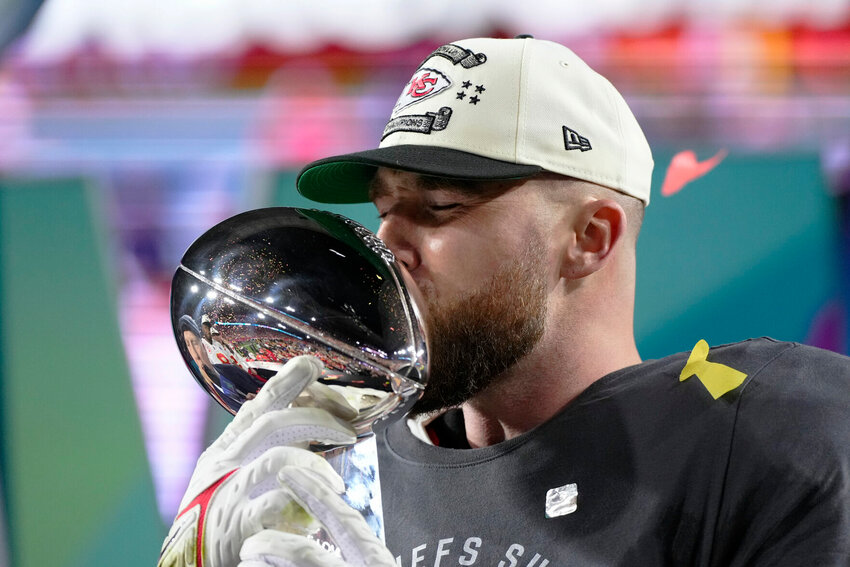 Kansas City Chiefs tight end Travis Kelce (87) kisses the trophy after the NFL Super Bowl 57 football game, Sunday, Feb. 12, 2023, in Glendale, Ariz. The Chiefs defeated the Philadelphia Eagles 38-35.   PhotoCredit: Photo by Matt Slocum | AP Photo