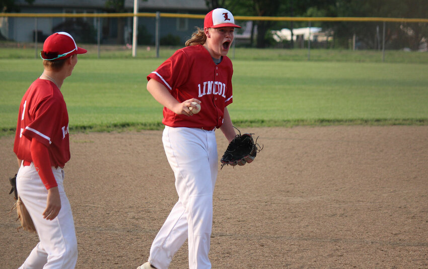 Lincoln freshman Hunter Vandaveer celebrates after catching the final out of Wednesday's Class 2 District 13 Championship against Windsor.   PhotoCredit: Photo by Bryan Everson | Democrat