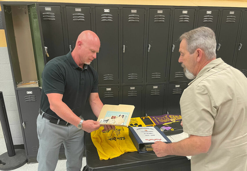 Sedalia Middle School Principal&nbsp;Brett Hieronymus, left, and head custodian Dave Quigley, an SMS alum, opened locker #1 Wednesday, May 24. It has been preserved as a time capsule for 50 years until Wednesday.   Photo by Chris Howell | Democrat