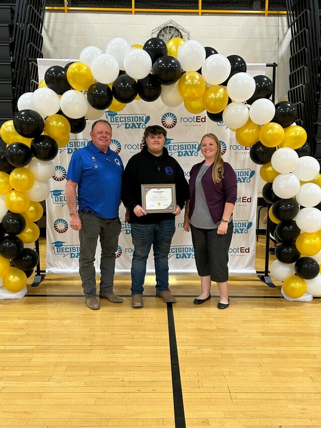 From left, Grand River Welding Institute Recruiter Kevin Judas, scholarship recipient Chance Brown, and WILS Independent Living Coordinator Samantha Jarvis pose for a photo as Brown receives his scholarship certificate at Smithton's Decision Day for Seniors.   Photo courtesy of WILS