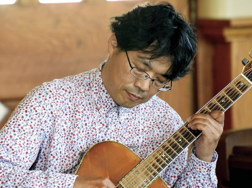 Guitarist Takashi Hamada, of Otaru, Hokkaido, Japan, plays Thursday morning at the Katy Depot during the Scott Joplin International Ragtime Festival. Performing at the festival is his first solo concert abroad.   Photo by Faith Bemiss | Democrat