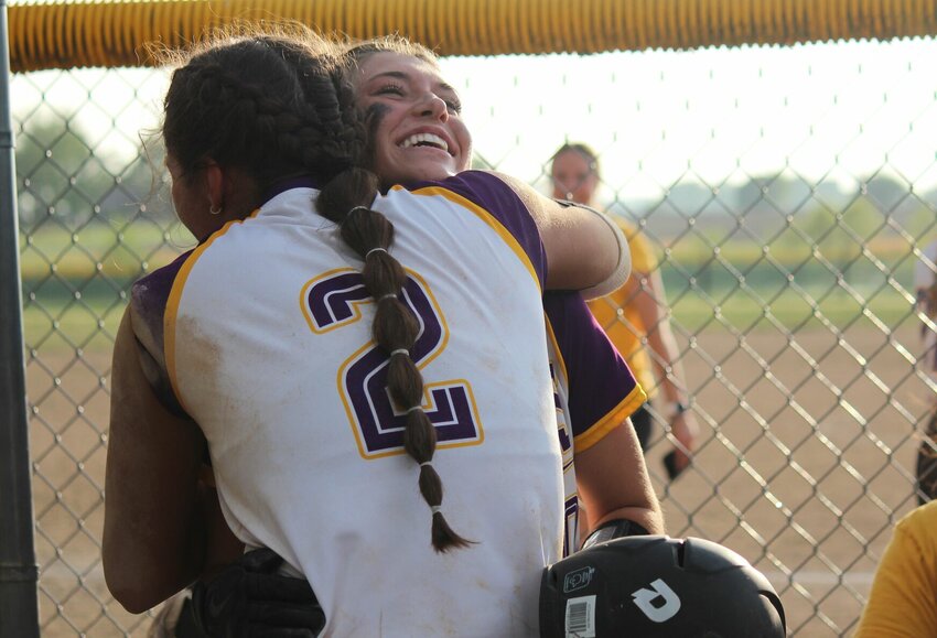 Green Ridge's Maria Heuman hugs teammate Kayley Goodman after Goodman's two-run home run in the sixth inning of Monday's district semifinal win over Northwest.   PhotoCredit: Photo by Bryan Everson | Democrat
