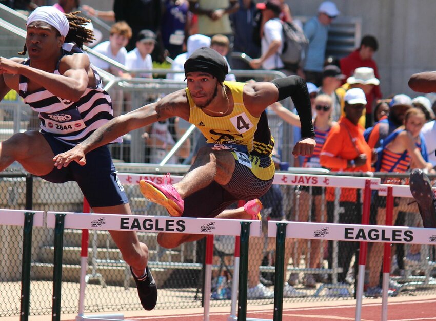 Smith-Cotton senior Derek Grubb wins his Class 5 preliminary heat in the 110-meter hurdles Friday afternoon, setting a PR in the process. Grubb is ensured a medal in both the 110 and 300-meter finals, set for Saturday.   PhotoCredit: Photo by Bryan Everson | Democrat