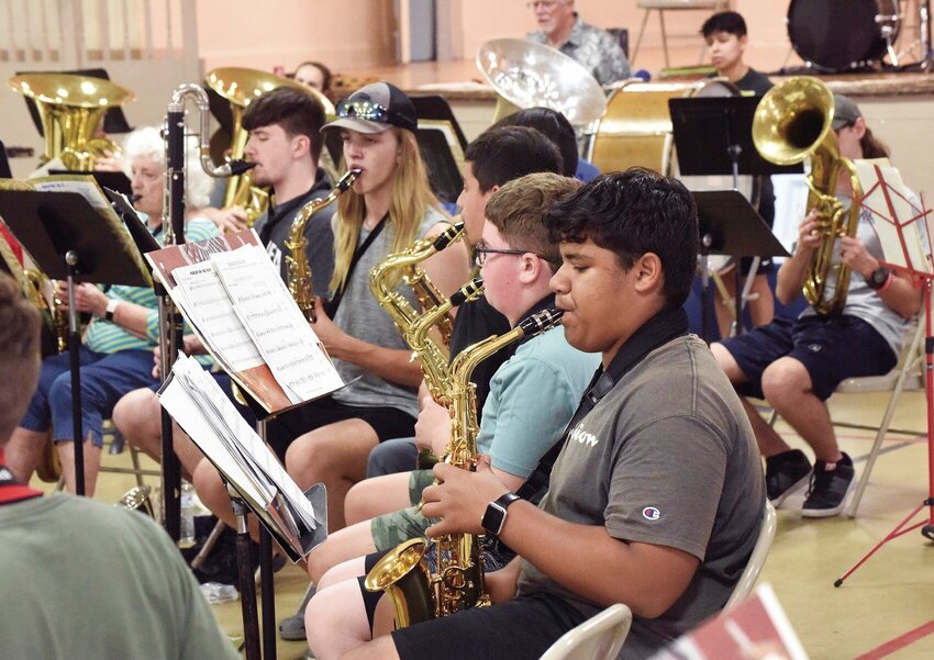 Sedalia Concert Band members rehearse Monday night, June 19 inside Convention Hall for their first performance at 7 p.m. Thursday, June 22 at Liberty Park. Band Director Sandy Greene said many members are youth from Smith-Cotton High School and other area schools.   Photo by Faith Bemiss | Democrat