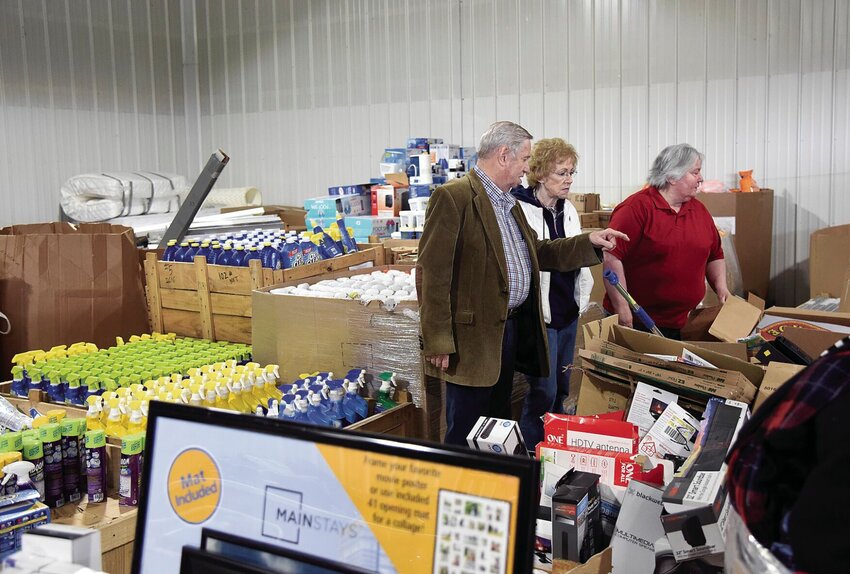In April 2019, from left, Heart of America ReDistribution Solutions &amp;amp; Support Inc. founder Jack Menges talks with board members, his wife, Sue, and Sue Foster, at the newly opened center. The 5,000-square-foot center provides non-food items for area not-for-profit groups.   File photo by Faith Bemiss | Democrat
