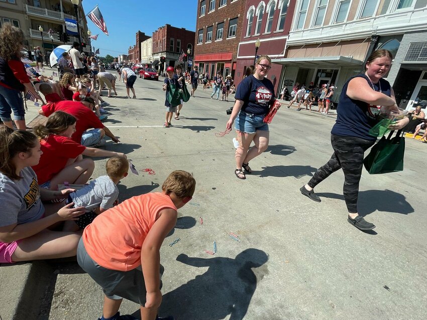 Kids brave the traffic to grab some candy thrown along the Fourth of July parade route in downtown Sedalia on July 4, 2022. The 2023 parade will be hosted at 10 a.m. Tuesday, July 4.&nbsp;   File photo by Chris Howell | Democrat