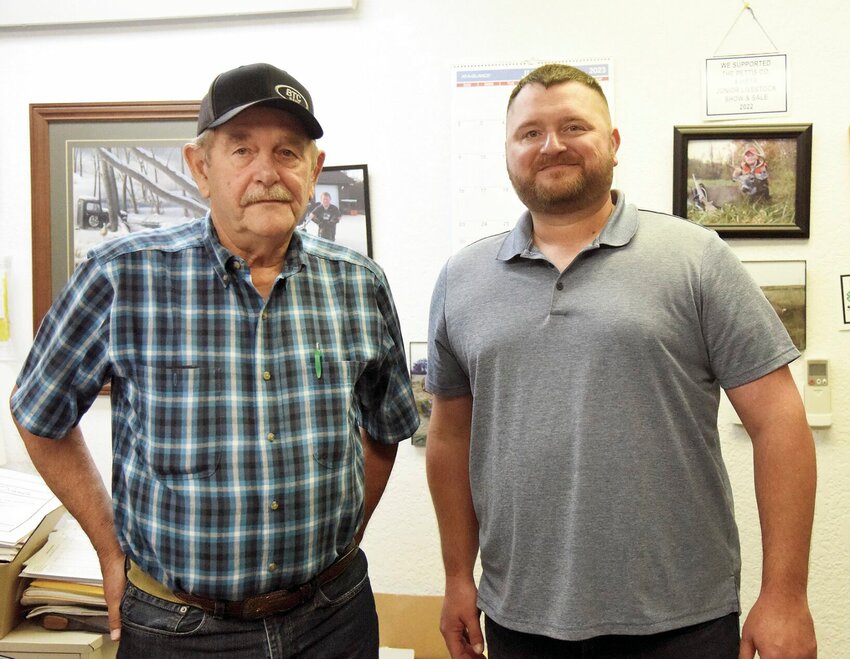 Mike Brown, left, and his son Travis Brown stand in the offices of B&amp;amp;P Excavating and Turpin Land Surveying on Wednesday, July 19. Mike Brown, who owned the business, retired on July 1 and has allowed the employees to own the company through an Employee Stock Ownership Plan.   Photo by Faith Bemiss | Democrat