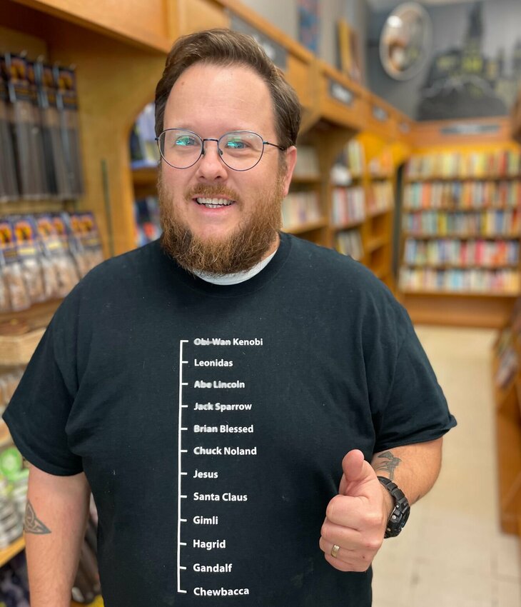 Matt Petree is the owner of Reader's World, a Sedalia bookstore with unique gifts, humorous cards and novelties. The new Reader's World location is in the same shopping center as before, but it's now located around the side next to Sherwin Williams.   Photo by Chris Howell | Democrat